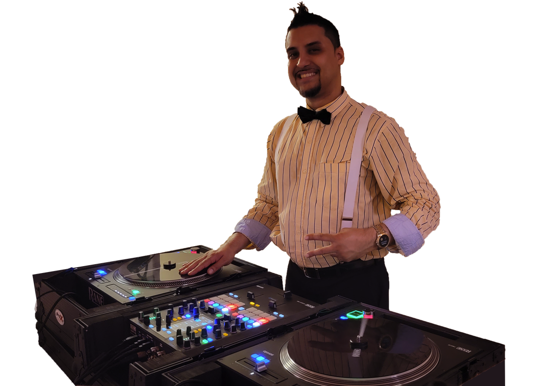 DJ-JP in a striped shirt and bow tie, smiling behind his turntables and mixer